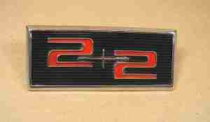 1964 2+2 front fender & decklid ornament '2+2'