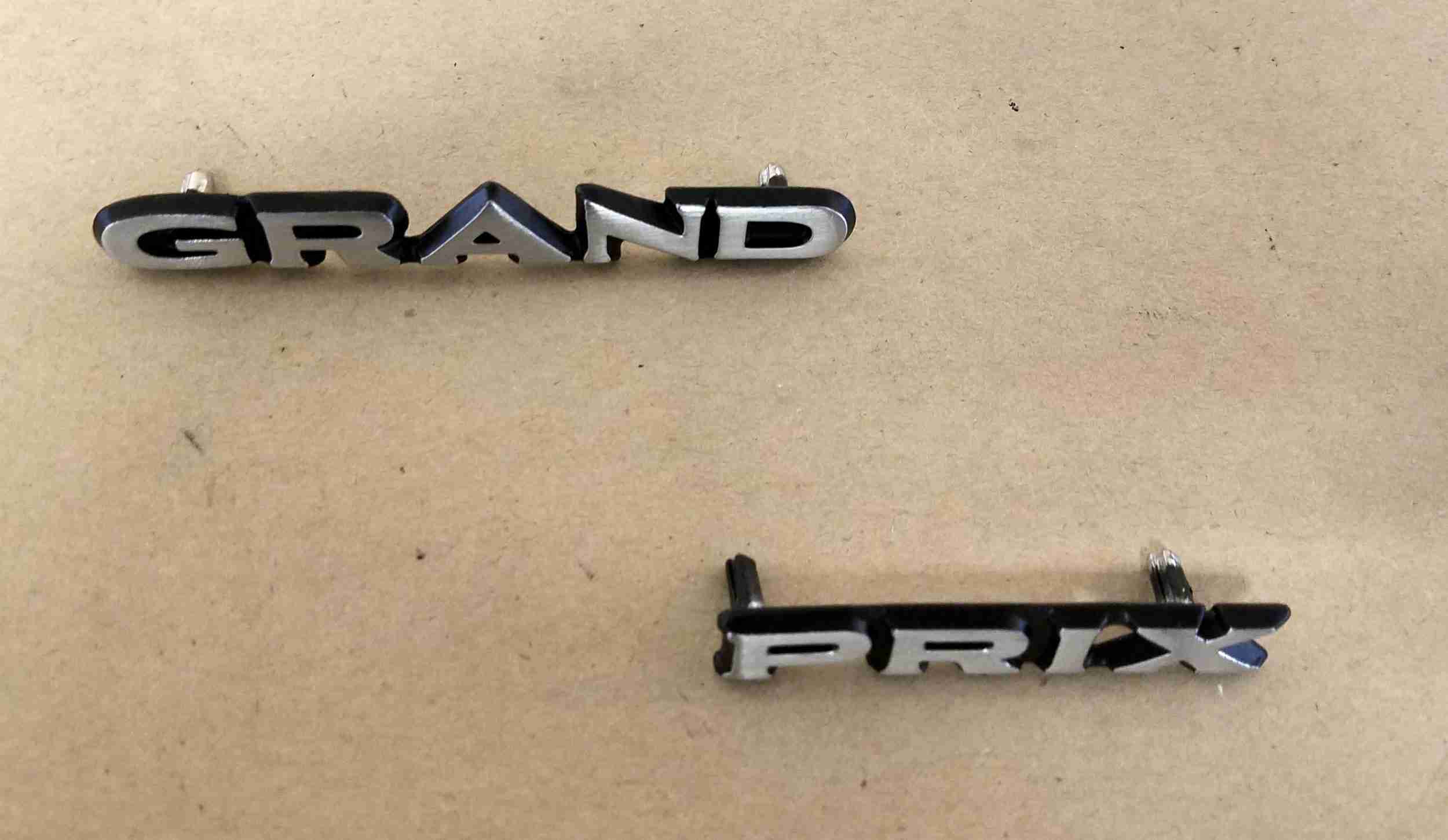 1970 Grand Prix Roof Panel Emblem Set, consists of one 'Grand' and one 'Prix'